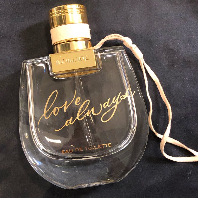 engraved calligraphy on perfume bottle, brand activation live calligraphy engraving event