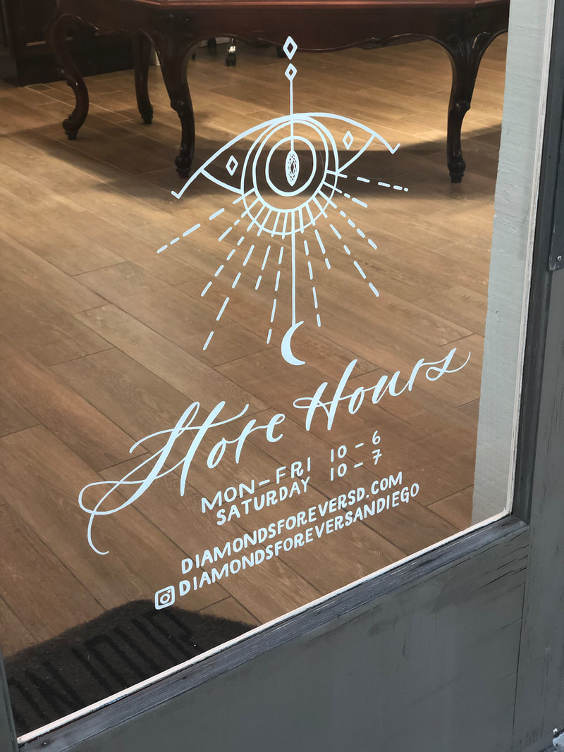 Hand-painted store hours calligraphy window for Diamonds Forever San Diego